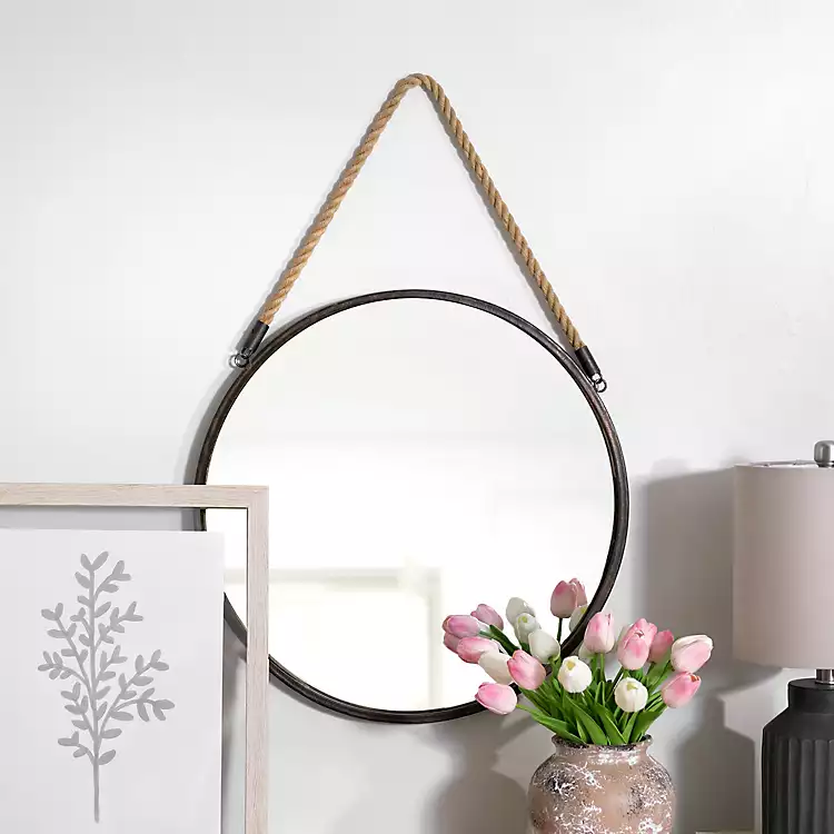 A metallic hanging mirror
